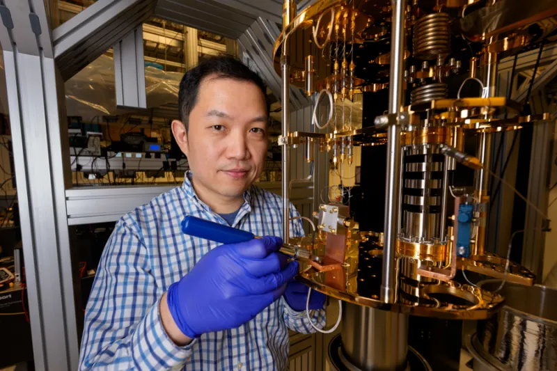 University of Chicago Pritzker School of Molecular Engineering Asst. Prof. Tian Zhong working on a quantum computer